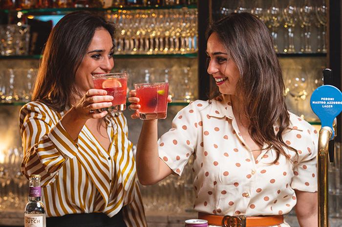 Photo of Double Dutch twins toasting their tonics