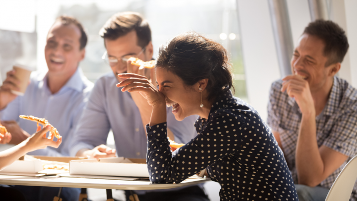 People laughing in a work meeting 